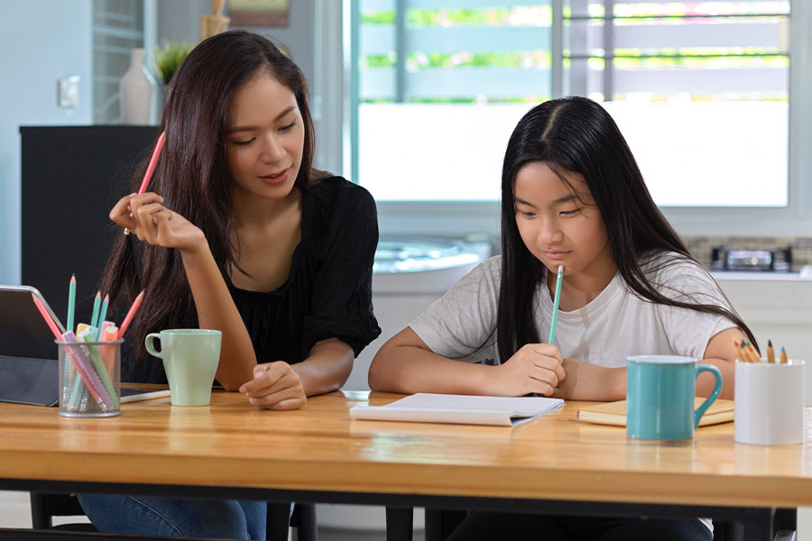 student and tutor together at a desk in Brooklyn